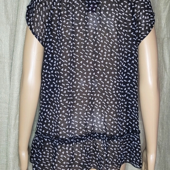 Black and white top. Size L. The brand is Fire and is 100% polyester. - Picture 4 of 4